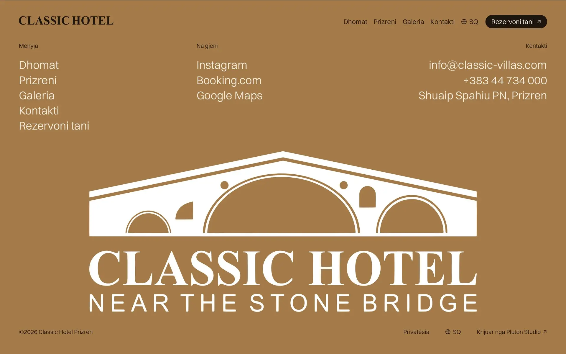 The Classic Hotel footer in Albanian on bronze, the hotel's bridge logo set large under the links