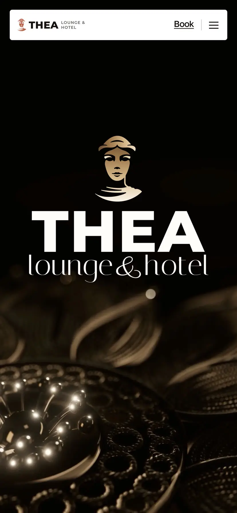 The Thea homepage on a phone: the goddess mark and THEA lounge & hotel over the filigree film