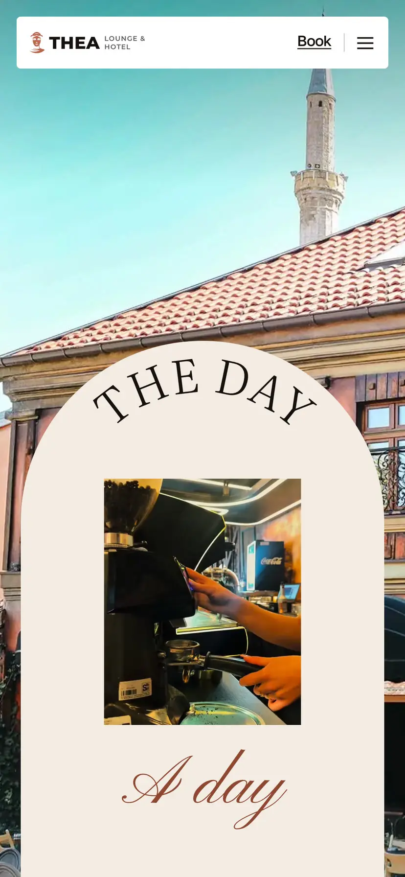 A day at Thea on a phone: the cream arch with THE DAY on its curve over the façade